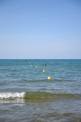 Buoys in the Water on the Sea by Summer