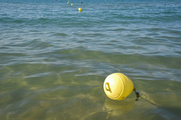 Buoys in the Water on the Sea by Summer
