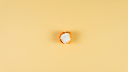 Colorful muffin dancing on yellow background. Concept of bakery products and confectionery.