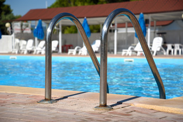 Stairs in the Swimming Pool at Summer by Morning