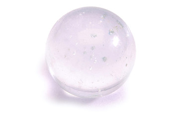 transparent glass sphere with inclusions on a white background