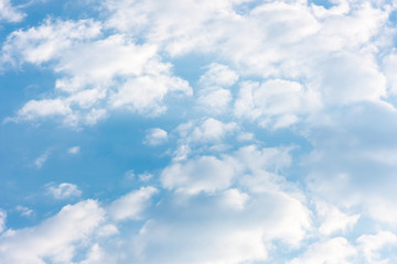 blue clouds on the sky in the rays of the sun in the fall. Landscape background texture, copy space
