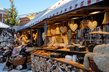 Christmas market at the Dome square in Riga Old Town, Latvia. Pavilion store sale Xmas decorations,...