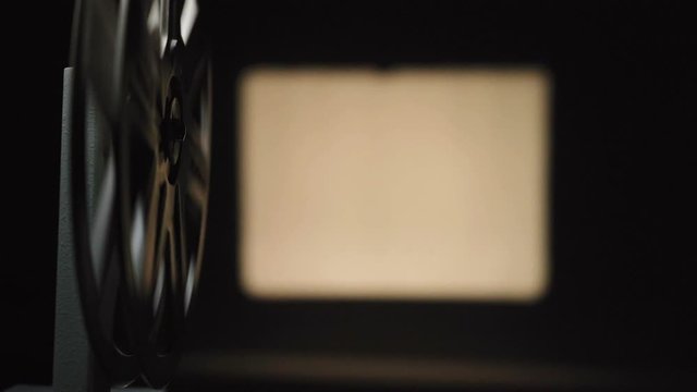 Video of old projector filming on black background