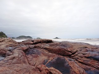 Big rocks and, sea and islands in the deep.