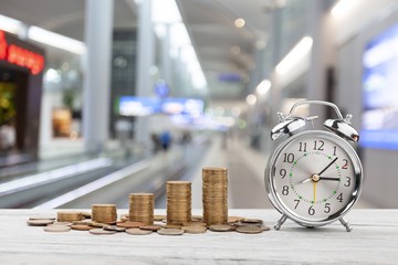 Coins and alarm clock.