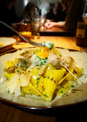 Pappardelle ai Funghi plating with a Poached Egg.