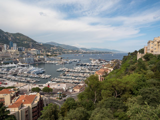 Obraz premium Monaco, july 2019: Panoramic view of port. Azur coast. Colorful bay with a lot of luxury yachts in sunny day