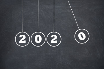 New Year 2020 Newton's Cradle on Chalkboard