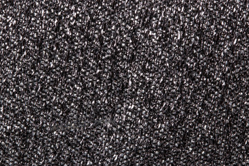 Glitter lights background. Close-up of a seamless black silver shiny glitter light background. Macro photograph of a silver black crystal shiny fabric material for luxury design.