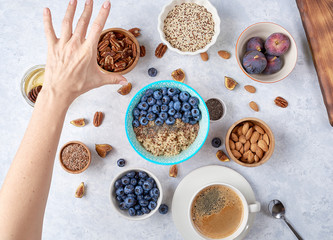 Ingredients for a healthy breakfast, quinoa with blueberry, fig, honey and nuts. Concept vegan and healthy eating. Top view