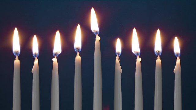 Video Of Eight Lit Hanukkah Candles ON GRUNGE BACKGROUND And Shamash