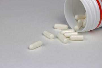pills, vitamins or dietary supplements on a white background