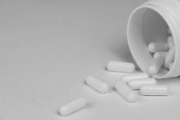 pills, vitamins or dietary supplements on a white background