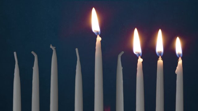 Video Of Three Lit Hanukkah Candles ON GRUNGE BACKGROUND And Shamash