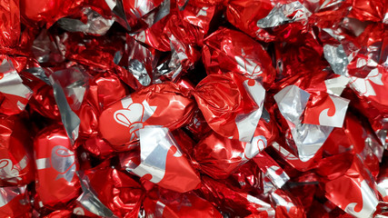 A heap of hungarian christmas sweetness fondant wrapped various colorful metal  papers