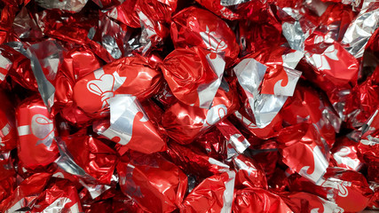 A heap of hungarian christmas sweetness fondant wrapped various colorful metal  papers