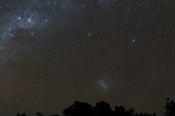 Milky Way and starry night sky over the mountains on the island of Bali