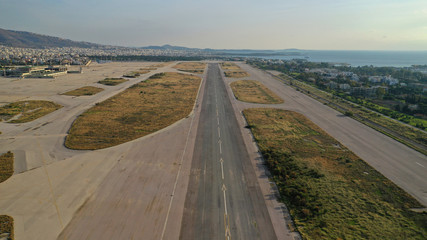 Aerial drone photo of abandoned runway in former international airport of Greece in Elliniko area, South Athens riviera, Attica, Greece