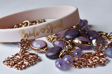 bride squad purple jewelry close-up