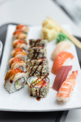 Sushi Roll Set with Seafood on White Plate