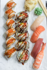 Sushi Roll Set with Seafood on White Plate