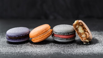 colorful macaroons on a dark background