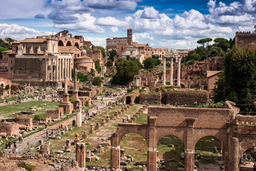 Fototapeta na wymiar Panoramic view of the Roman Forum Foro Romano and Ruins of Septimius Severus Arch and Saturn Temple in Rome, Italy