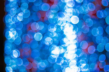 Blurred background of New Year Christmas decorations and lights.