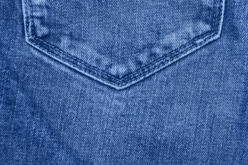 Stack of jeans on table. classic blue color. color of year 2020. Ecology and recycling.
