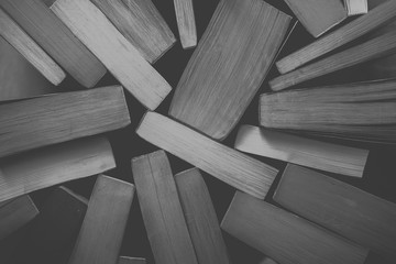 Old vintage books background in black and white. 