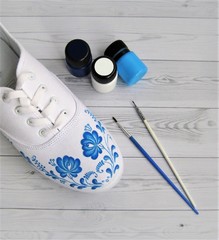 Create a fashionable design painting white sneakers