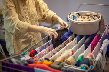 Washing clothes at home. Mom erases things.