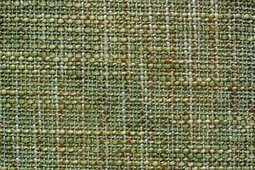 Color fabric texture. Woolen soft crumpled fabric of a green shade. Copy space.