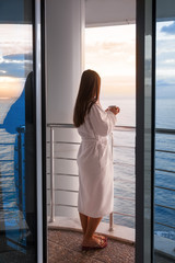 Woman drink coffee on hotels balcony on holiday rest.