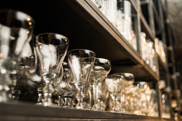 Wine and beer glass shelves in a restaurant or pub