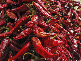 Garlands of red dried paprika pods in Budapest spice shop, Hungary. Natural food background.  