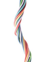 Swirl of colorful pasel electrical cable used in computer telecommucication network and electric installayion, isolated on white background
