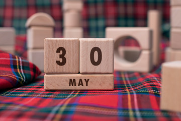 May 30 written with wooden blocks