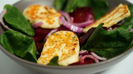 Salad of fried Halloumi cheese, beets and chicken