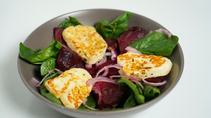 Salad of fried Halloumi cheese, beets and chicken