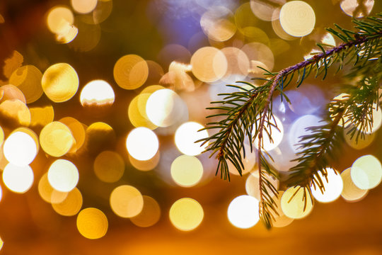 December Christmas decoration on Christmas tree bruches close up, blurred lights in the background / Christmas texture backdrop/ good wishes gift card/ space for text 2/8