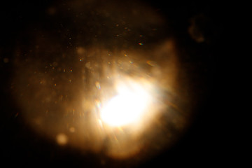 Easy to add lens flare effects for overlay designs or screen blending mode to make high-quality images. Abstract sun burst, digital flare, iridescent glare over black background.