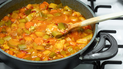 freshly cooked leek dinner in pots