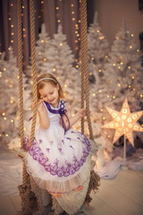 Little girl decorating christmas tree. Christmas. New Year