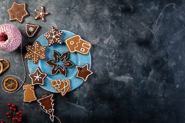 Various decorated gingerbread cookies on a plate