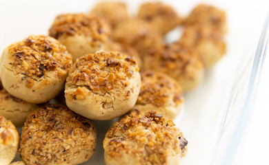 hazelnut and pecan cookies on white background