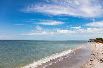 Fototapeta na wymiar Water, wave, beach and beautiful cloudes, Florida, USA