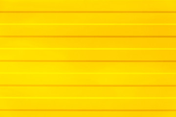 yellow texture. yellow fence with horizontal lines. yellow background. abstraction