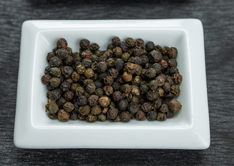Black pepper. Colorful spices in white bowls Seasonings for cooking. Natural Herbs & Spices.